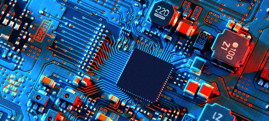 Blue electronic circuit board close up.