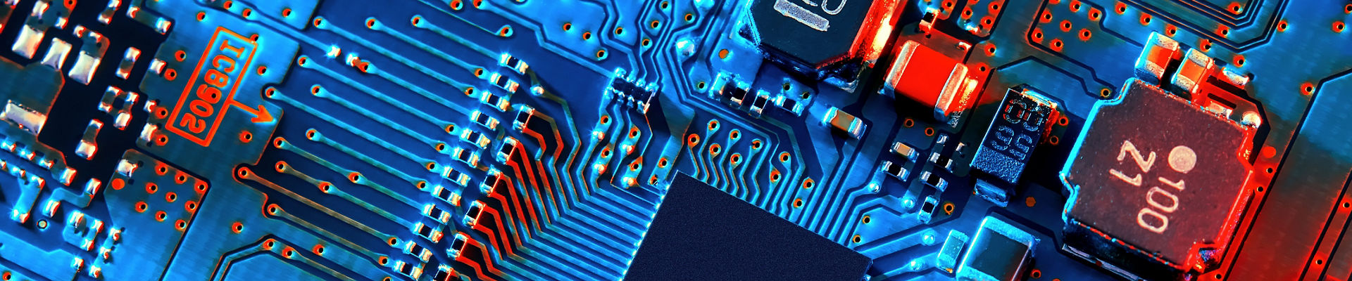 Blue electronic circuit board close up.