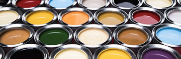 Open paint cans of different colors background