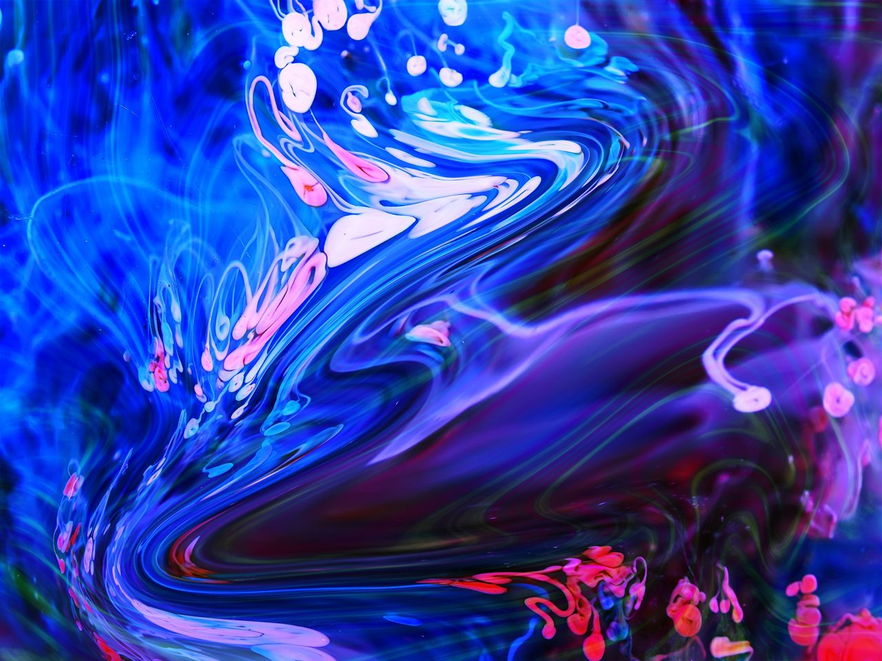 Swirled blue, pink and purple paint background