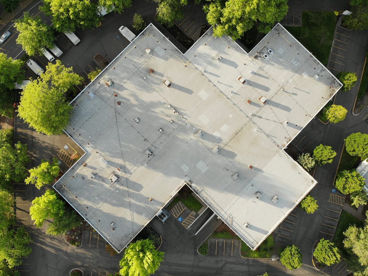 Photo of the roof of a large house and the landscape top view, texture for design.