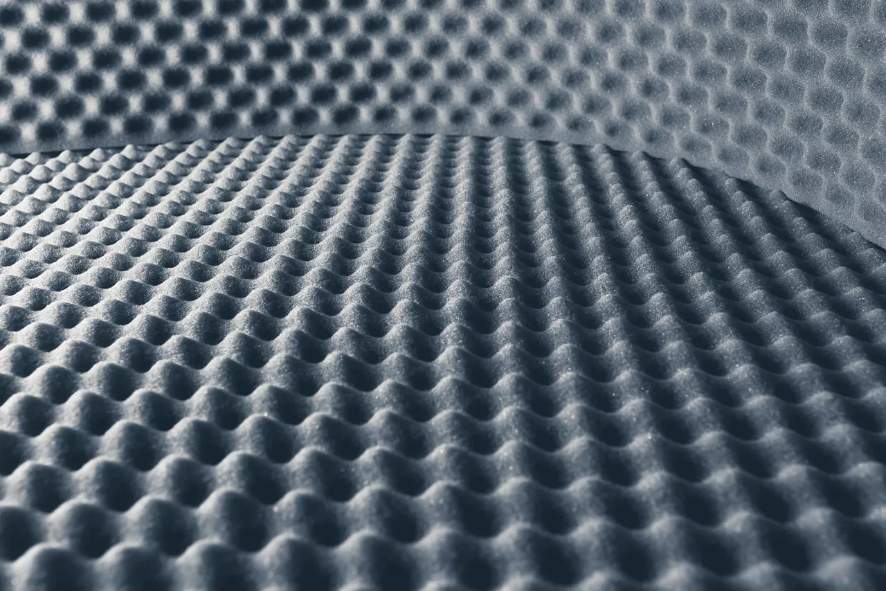 Acoustic foam abstract gray background, close-up.