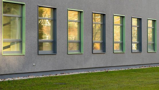 Wall of office building with windows. Modern exterior. Reflection in windows.
