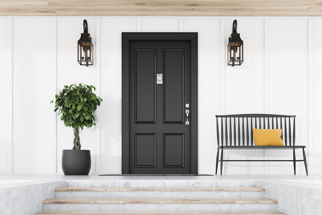 Stylish black front door of modern house with white walls, door mat, tree in pot, black bench, stairs and lamps. 3d rendering