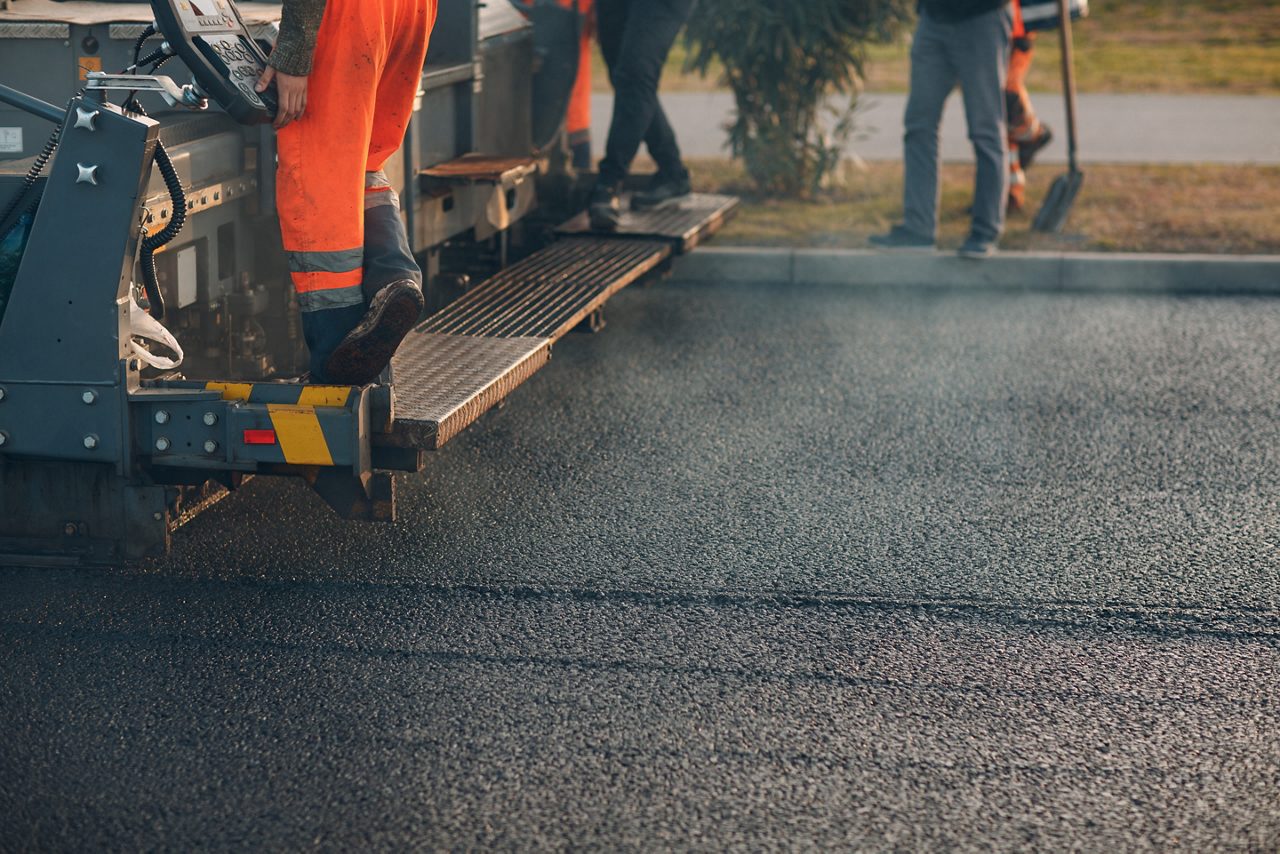 Workers Paving Asphalt