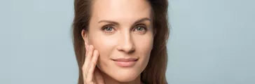 Portrait of beautiful woman touch healthy clean skin