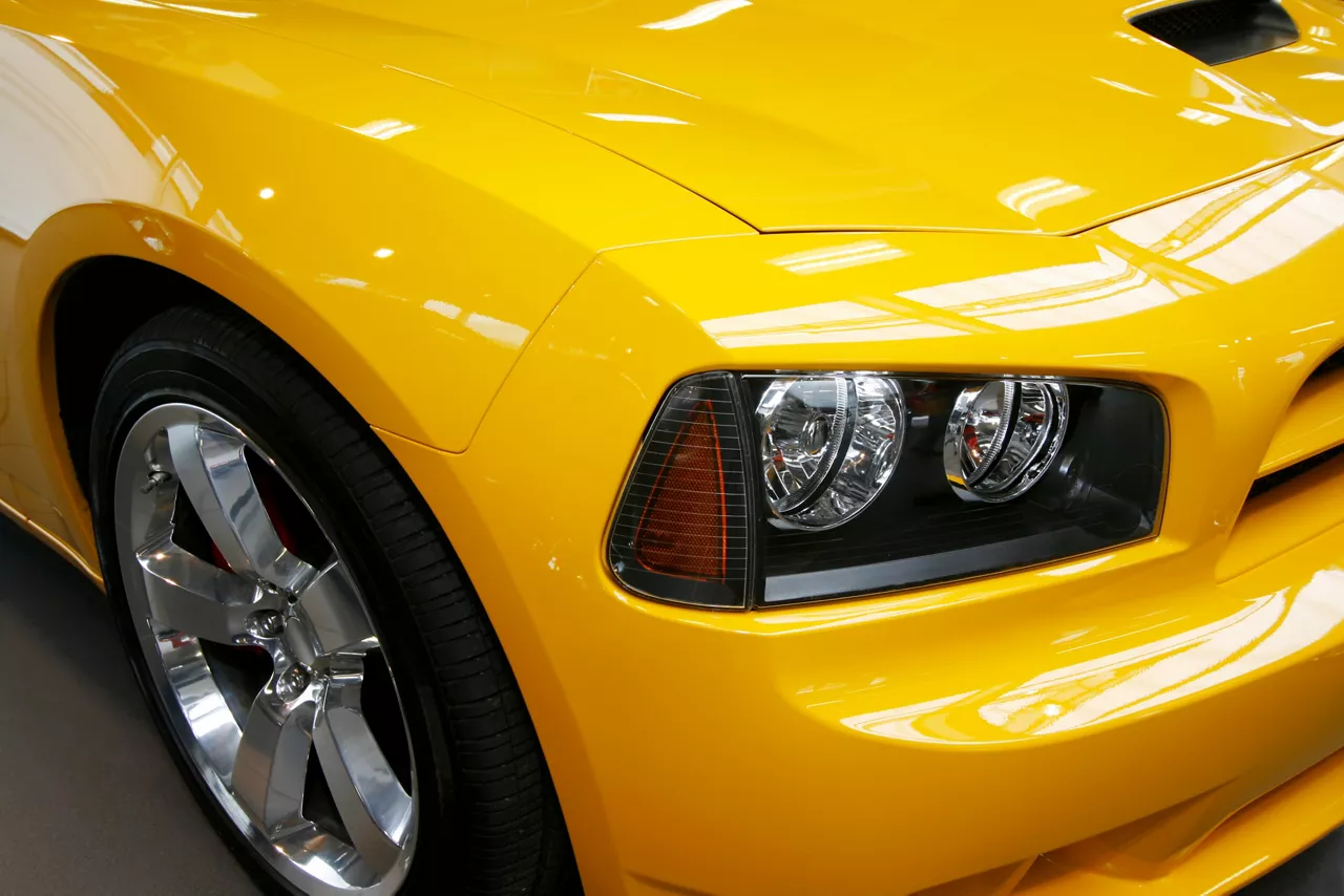  Closeup of a new modern yellow car headlight 