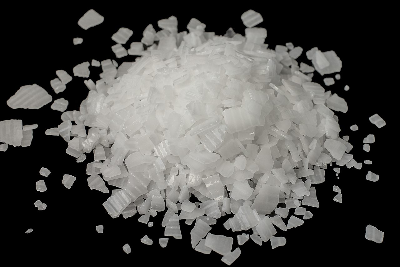 Caustic soda isolated on black background