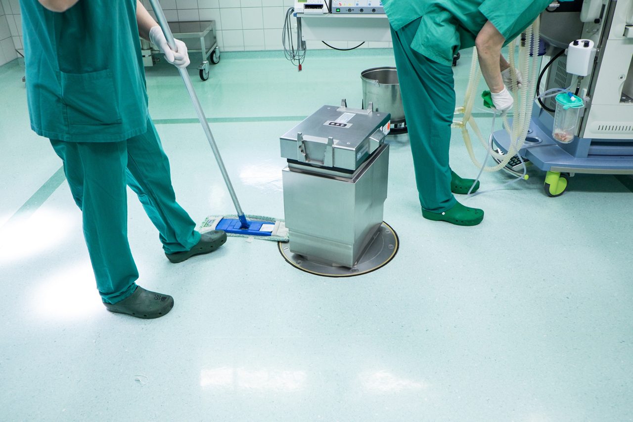 Cleaning an operating room in a hospital.