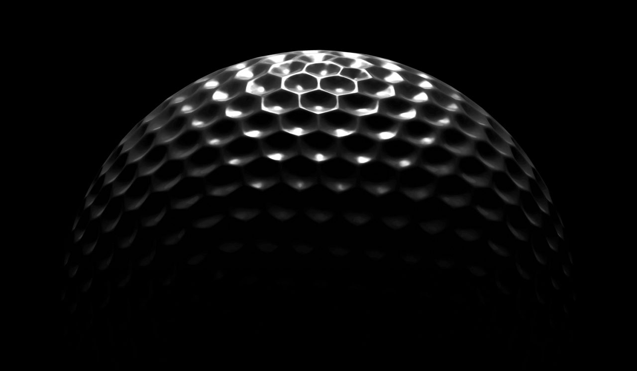 Golf ball in the dark, close-up.