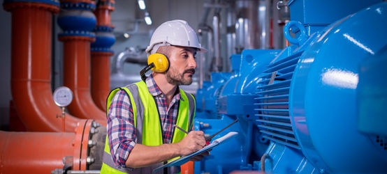 Engineer under checking the industry cooling tower air conditioner.