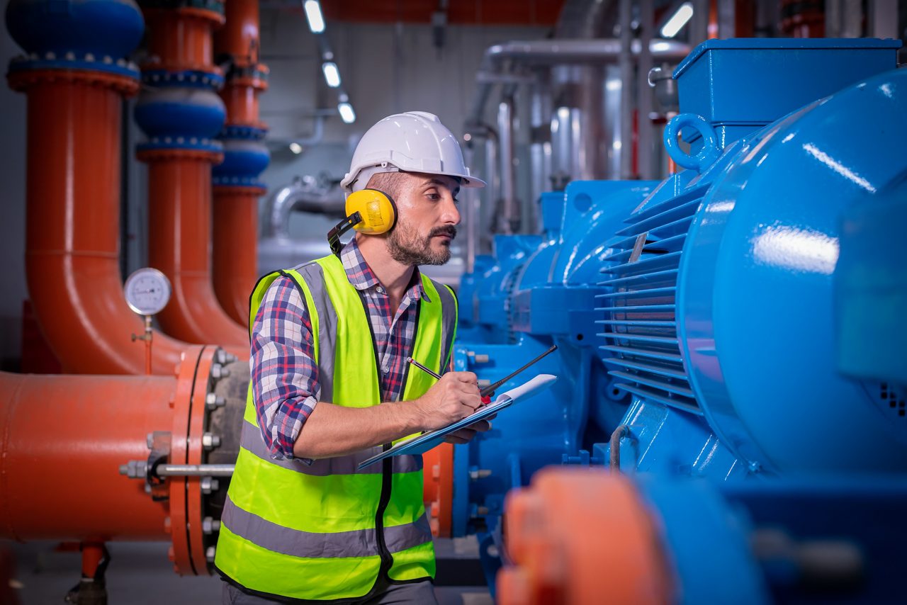 Engineer under checking the industry cooling tower air conditioner.