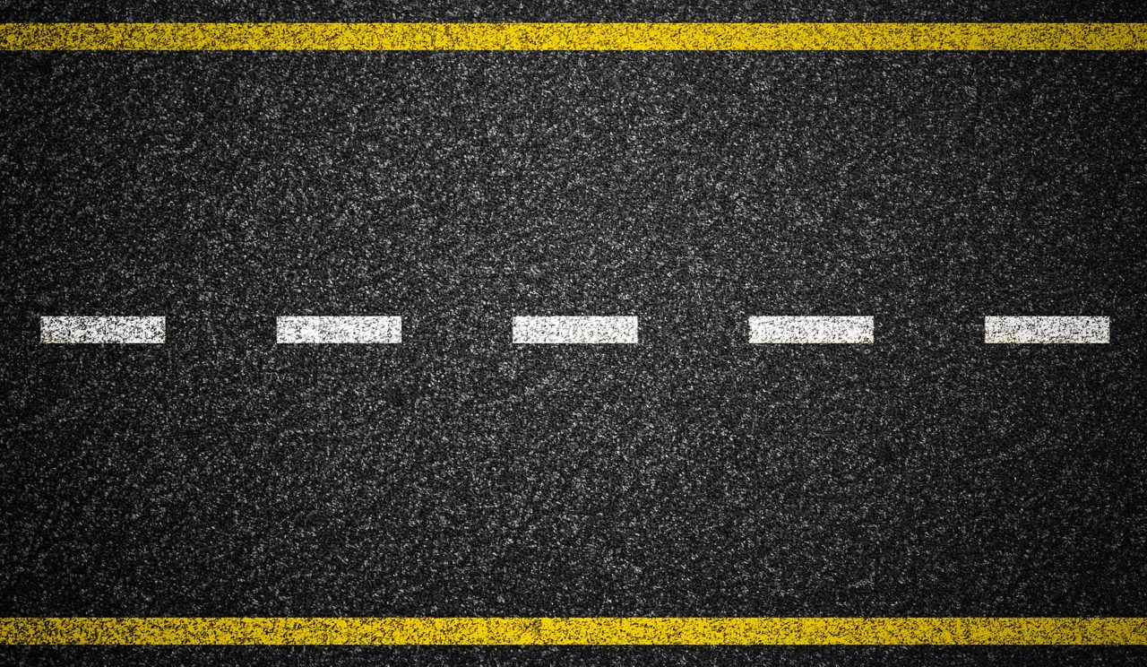 Asphalt highway with road markings background