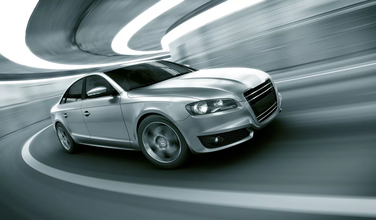 Silver car in tunnel