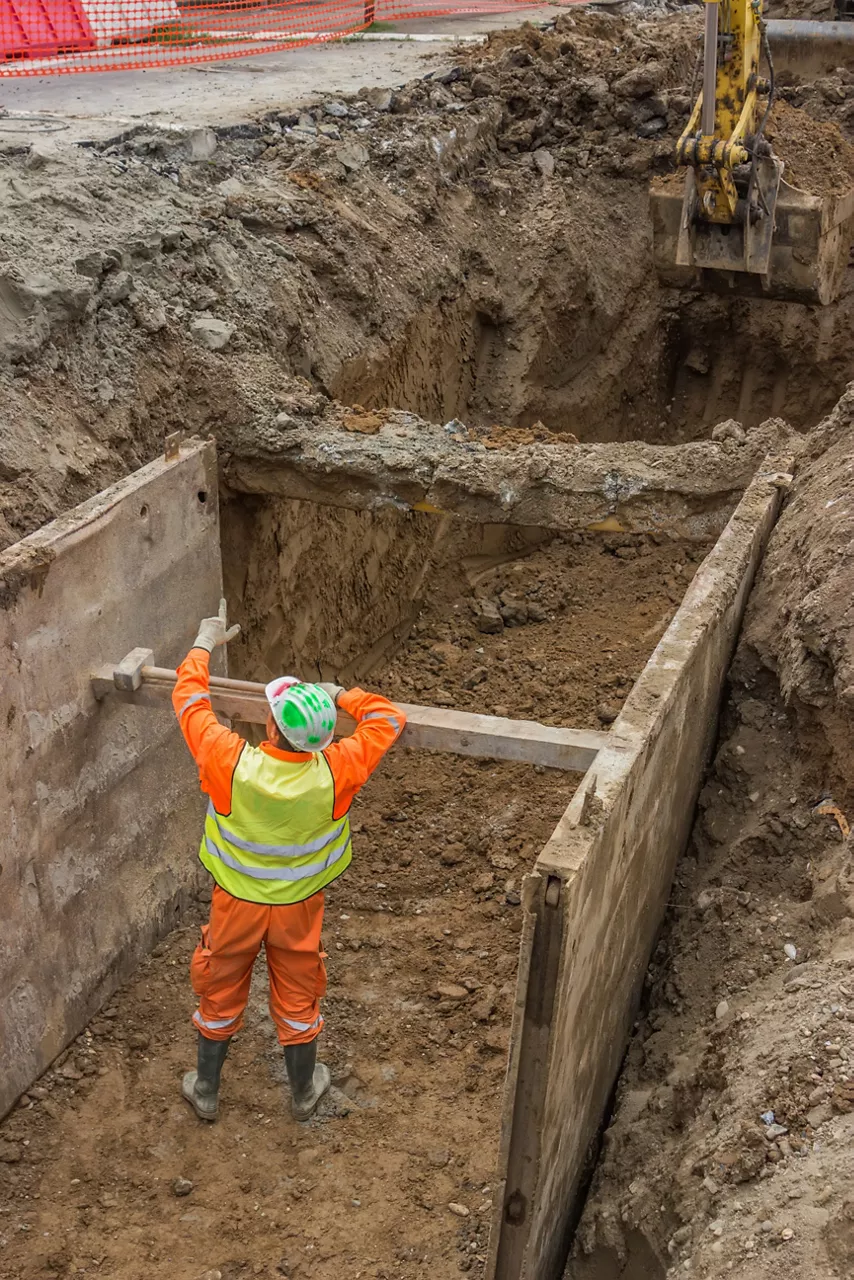 construction crew building a trench 