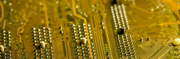 macro shot of a golden colored circuit board