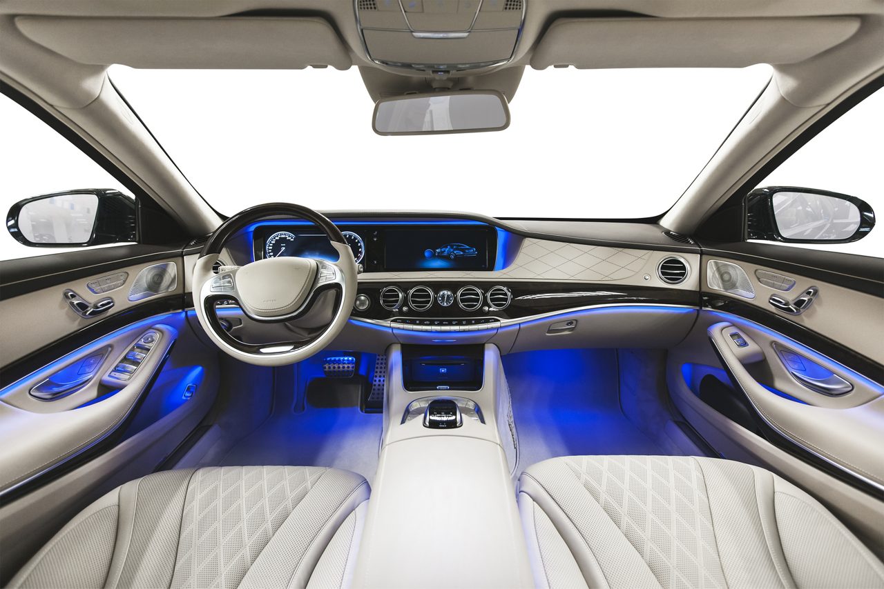 Light grey/gray car interior with blue lights along the dashboard and floor