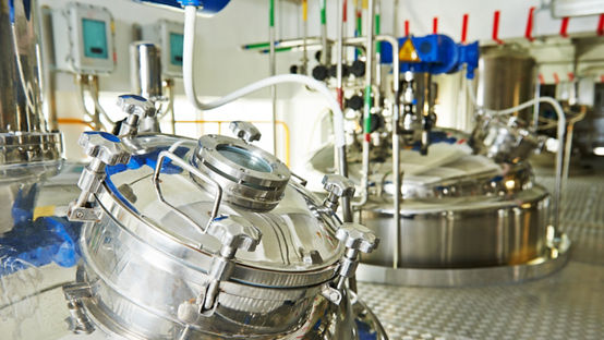 factory with pharmaceutical equipment mixing tank on production line in pharmacy industry manufacture factory