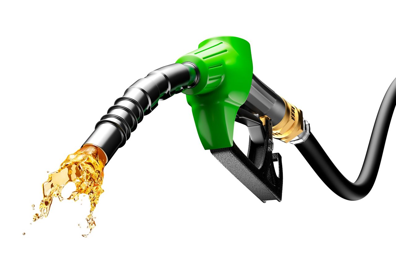 Gasoline gushing out from pump isolated on white background