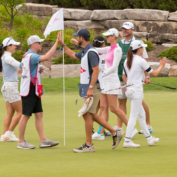 Dow Great Lakes Bay Invitational, July 12-17, 2021 - Golf teams greeting each other and giving a high five