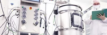 Scientist working with a bioreactor 