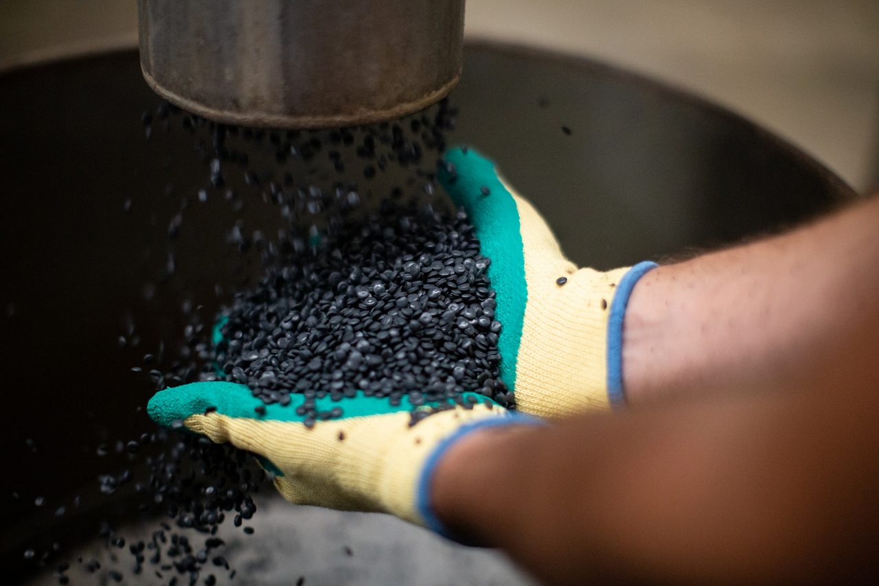 Person catching plastic pellets