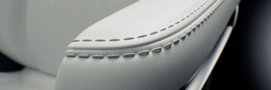 Primer plano de cuero Luxsense en el apoyabrazos del asiento del automóvil