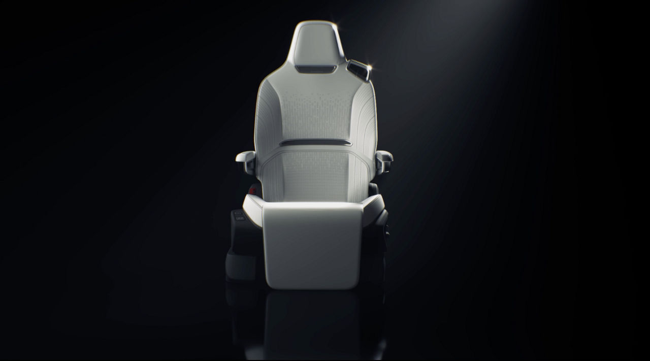 Automotive seat in off-white synthetic leather with dark background