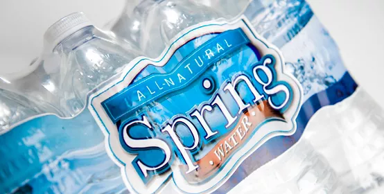 Package of spring water in recycled plastic