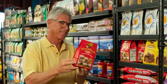 Man shopping for snacks in grocery store