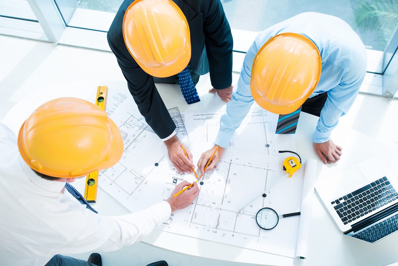 Image of constructor workers sketching together on the foreground viewed below; Shutterstock ID 157412990; PO: redownload; Job: redownload; Client: redownload; Other: redownload