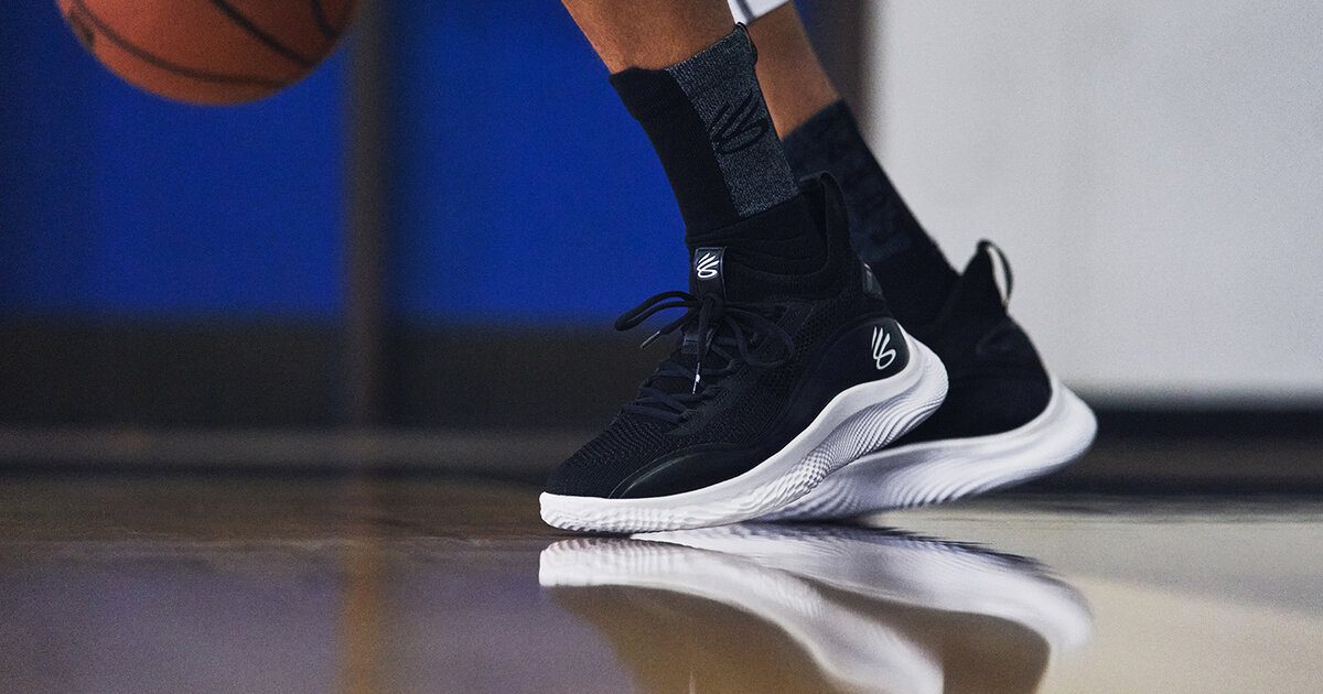 Basketball player wearing Under Armour Curry Flow 8 basketball shoes while playing basketball