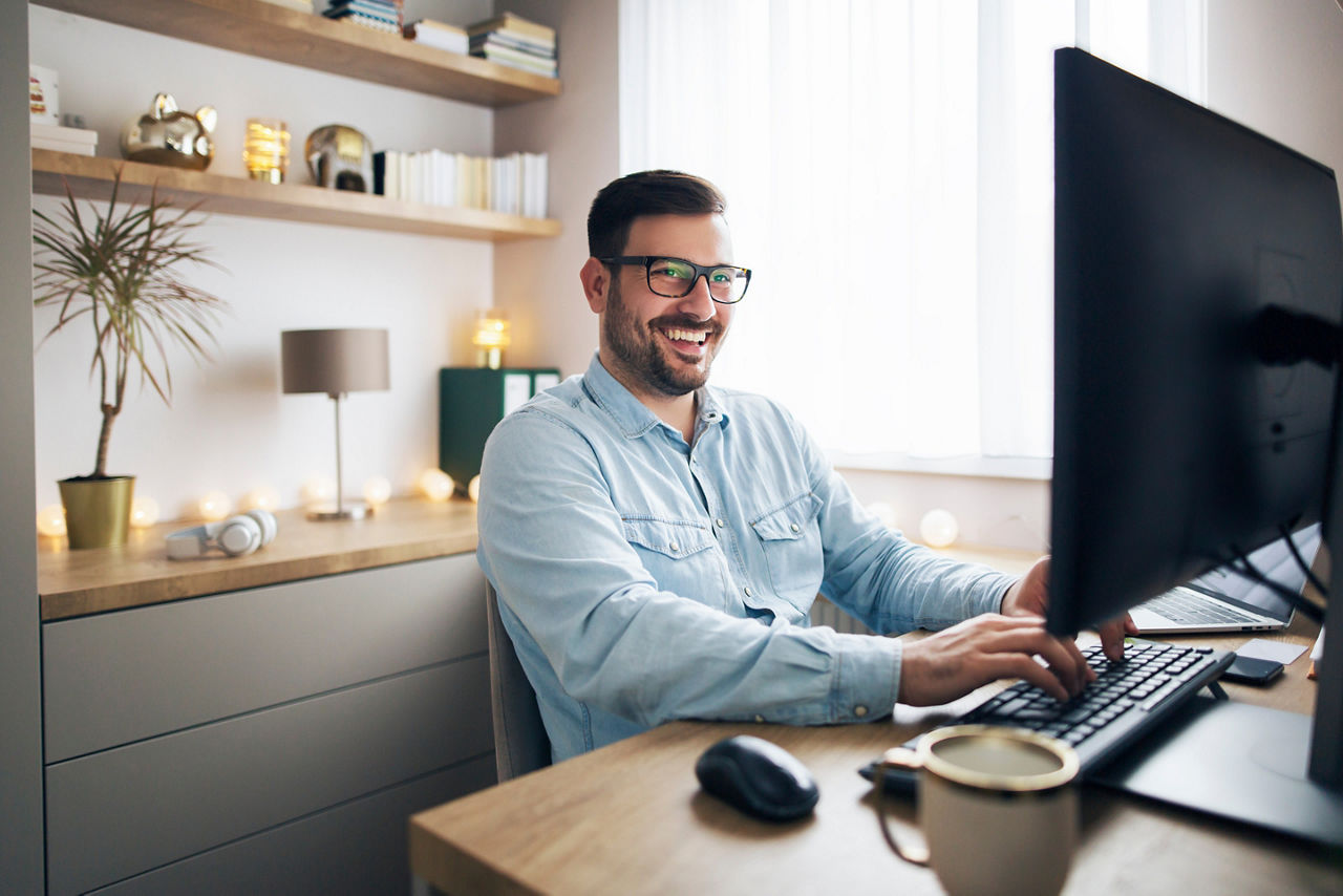 Modern young man working remotely from home.