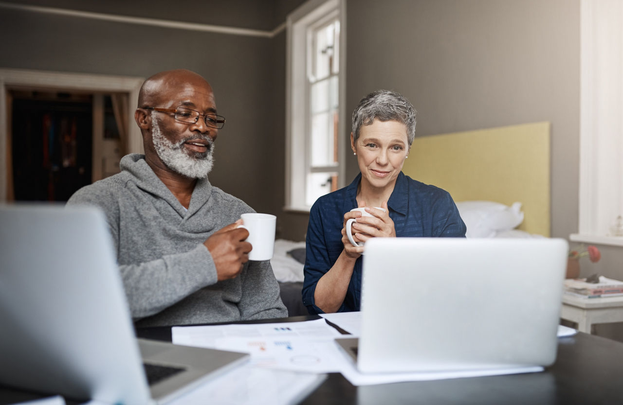 Shot of a senior couple working on their finances at home.