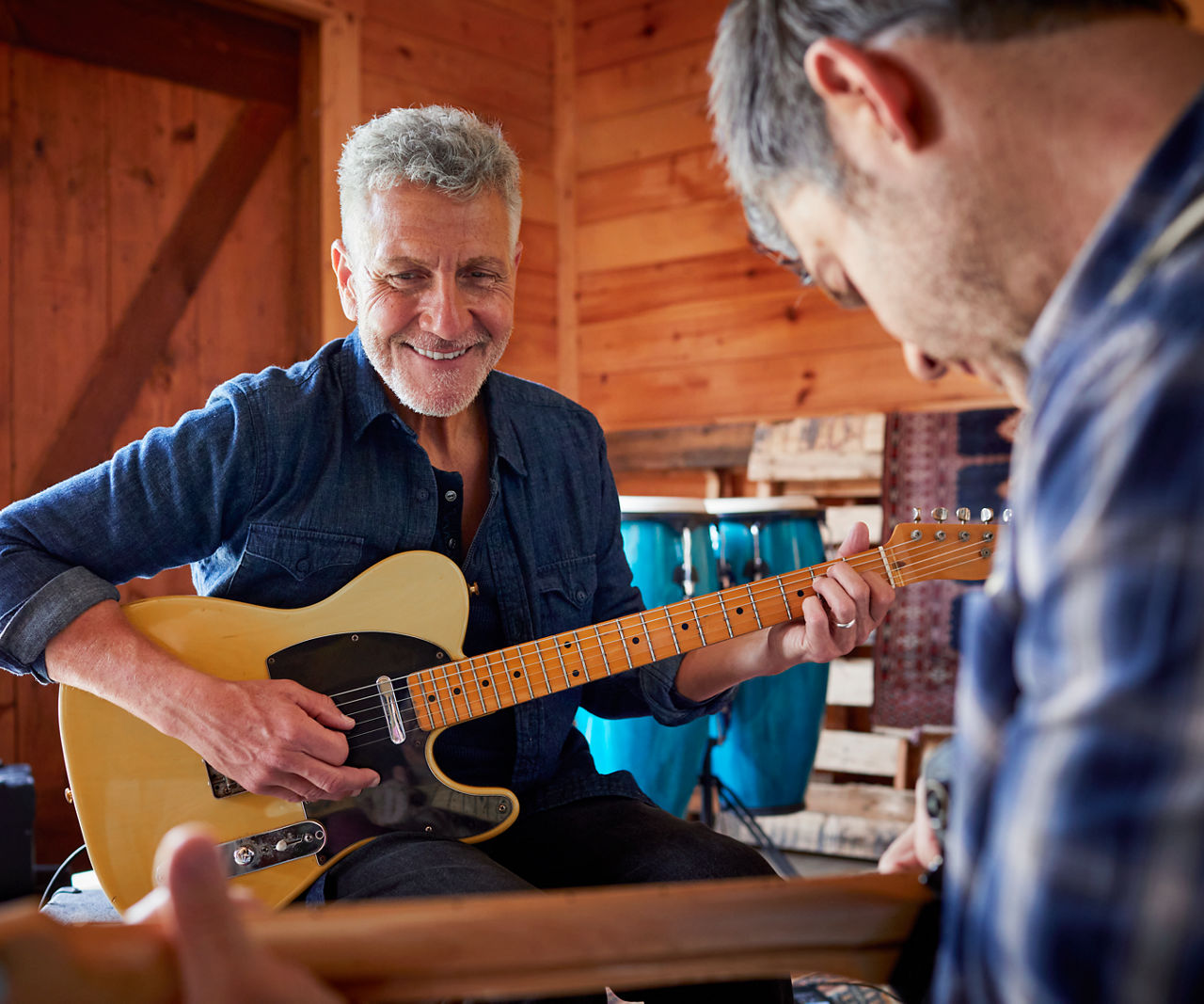 Man holding a guitar.