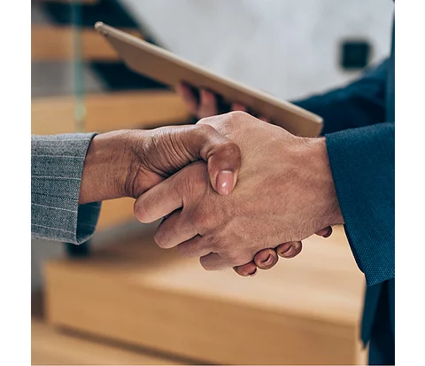 Close up of a handshake between client and planner
