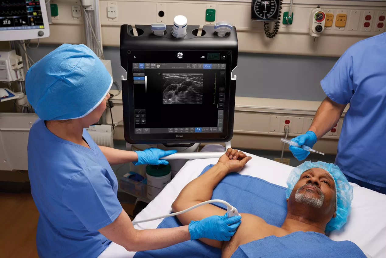 Doctor examining a baby with Venue