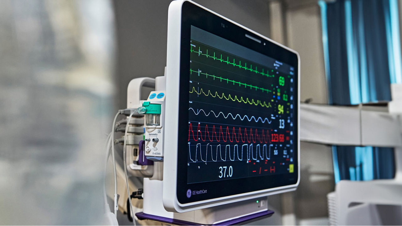 Wall mounted GE HealthCare's Carevance monitor with a respiratory module embedded