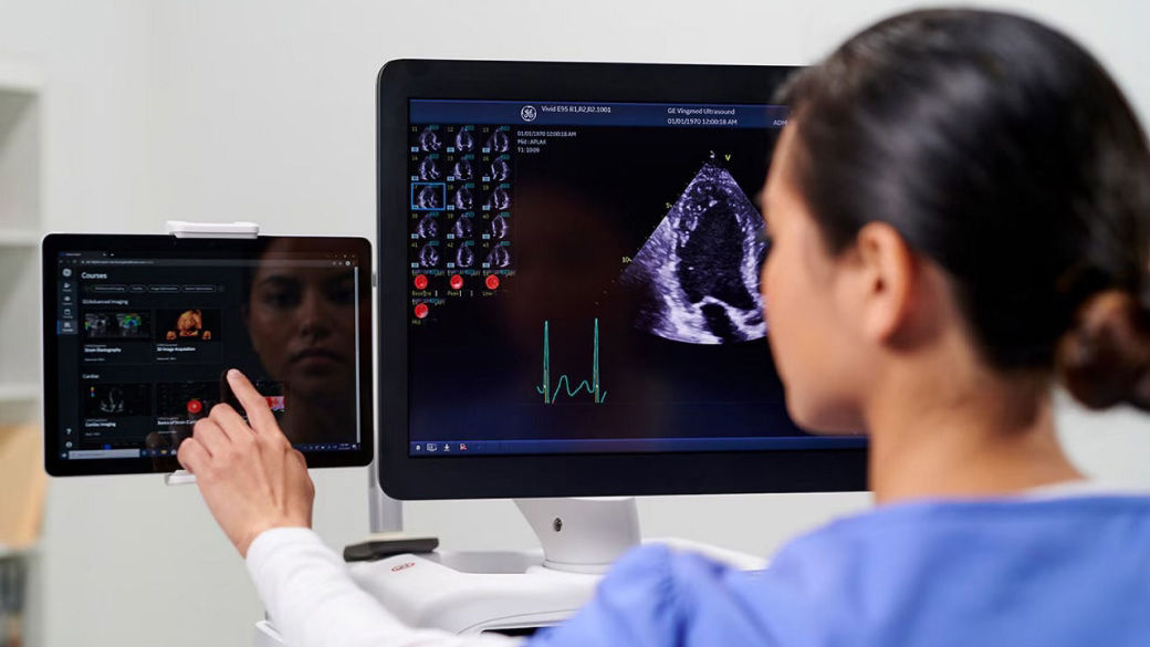 medical professional using a GEHC ultrasound machine
