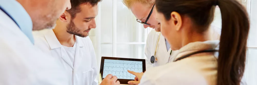 A_team_of_cardiologists_reviews_an_ECG