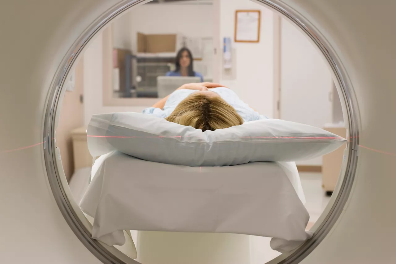 Caucasian-patient-on-MRI-scanner-in-hospital