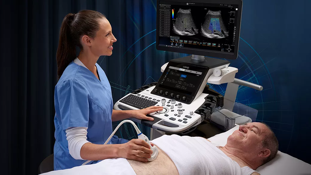 Clinician using an ultrasound on an elderly patient's abdomen