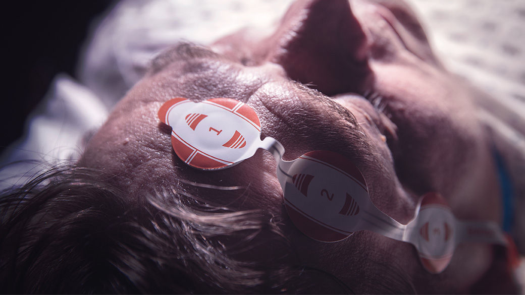 a close up of an anesthesia entropy monitoring system on a patient's forehead