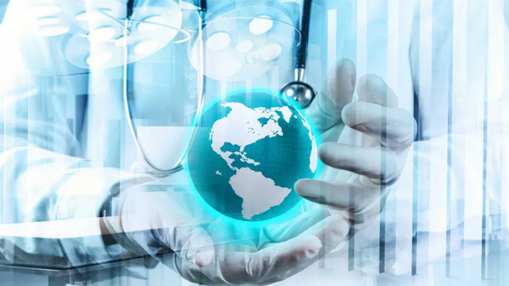 A clinician's hands holding the globe