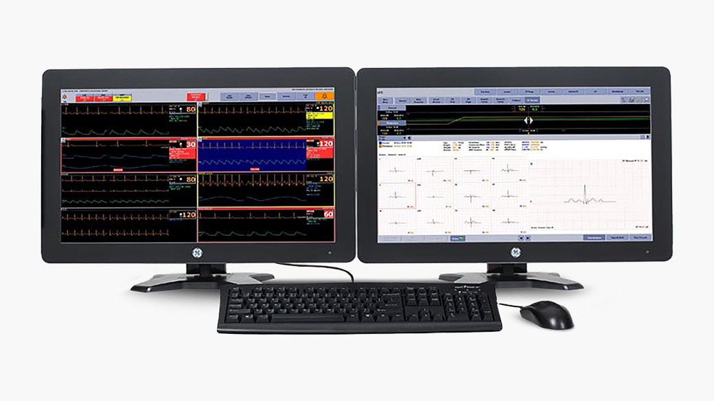 A computer with two monitors displaying CARESCAPE™ central station