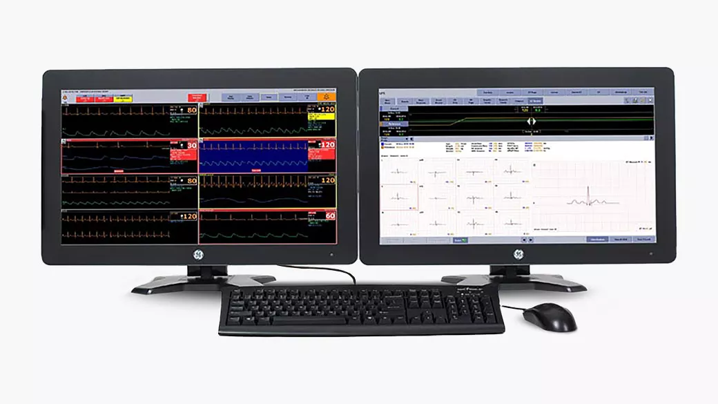 A computer with two monitors displaying CARESCAPE™ central station