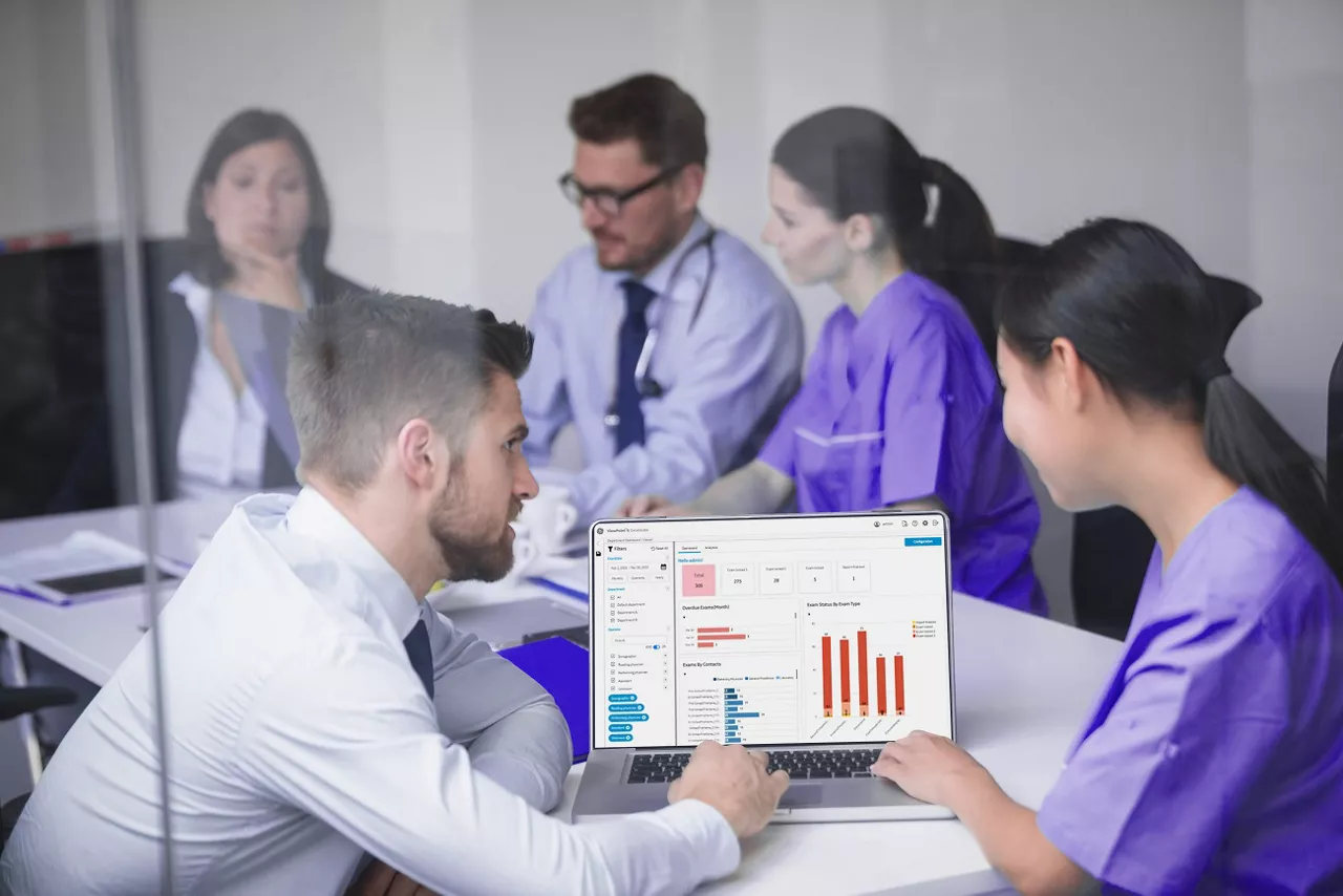 doctors-discussing-laptop-meeting-desktop