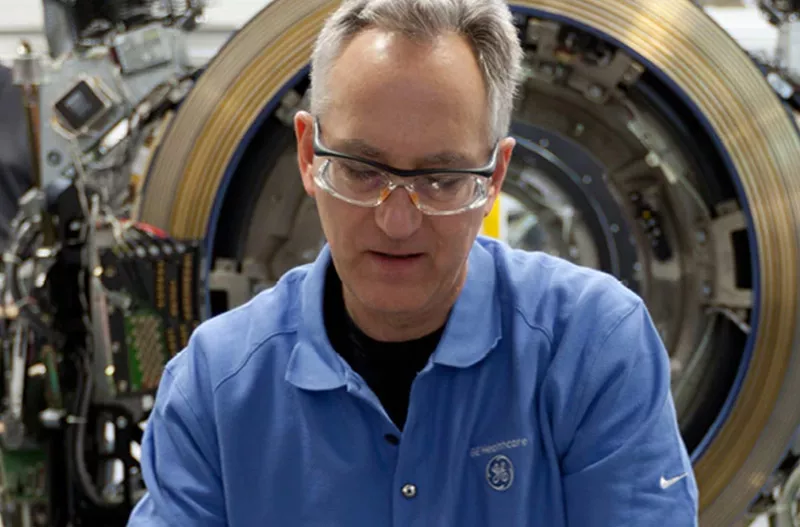 equipment technician working on a machine
