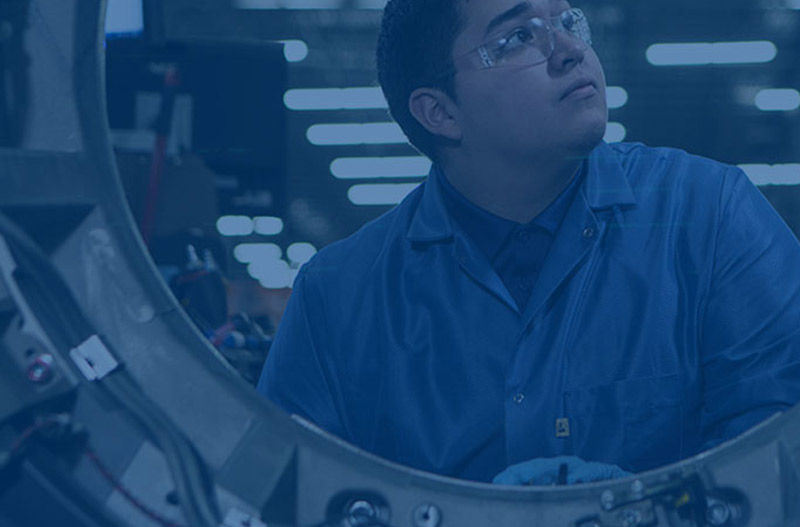 Young man working on repairing a machine