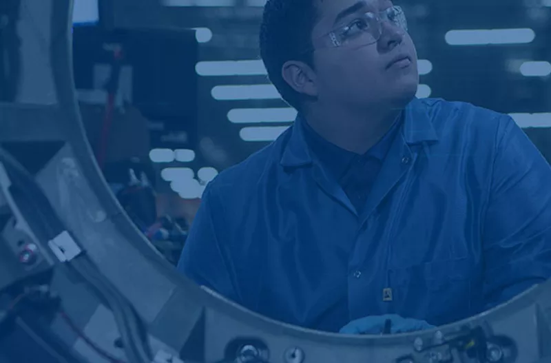 Young man working on repairing a machine